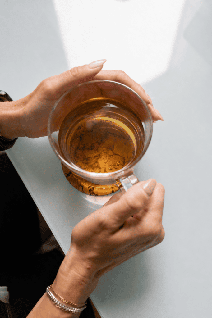 Perimenopause and Menopause Health – The Root Natural Health Clinic Woman enjoying herbal tea during perimenopause and menopause care in Mississauga